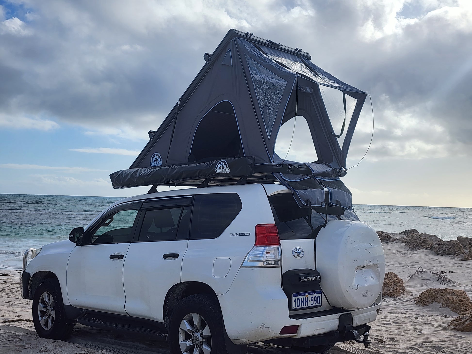 Side View of Ccamp Slimline Aluminium Rooftop Tent With Car