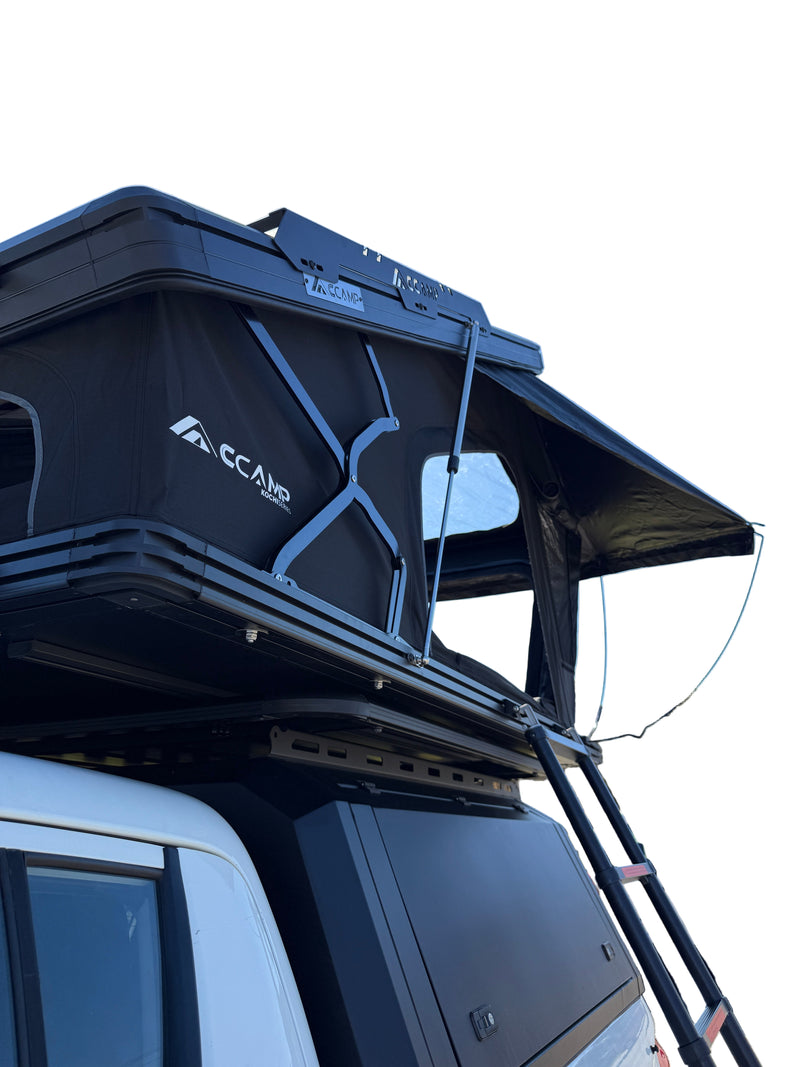 Load image into Gallery viewer, Black roof rack system on a vehicle with clear blue sky in the background
