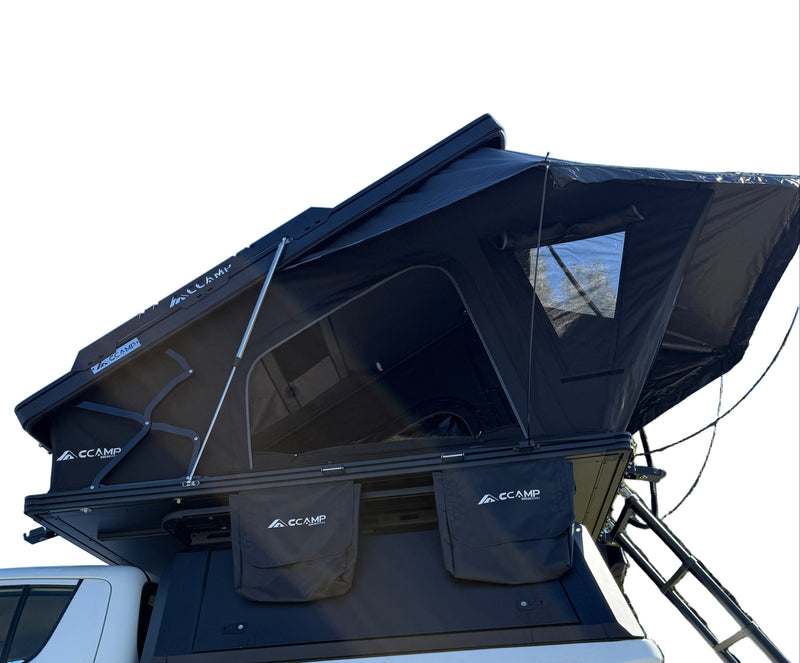 Load image into Gallery viewer, Black rooftop tent on a white truck against a white background
