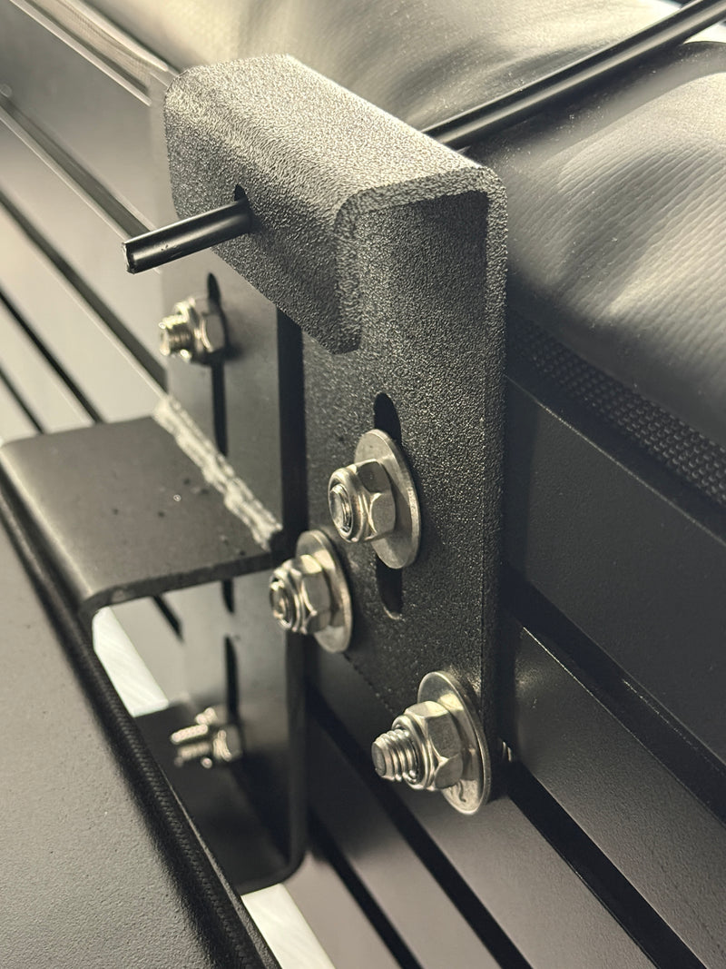 Load image into Gallery viewer, Close-up of a metal bracket with screws on a vehicle interior.
