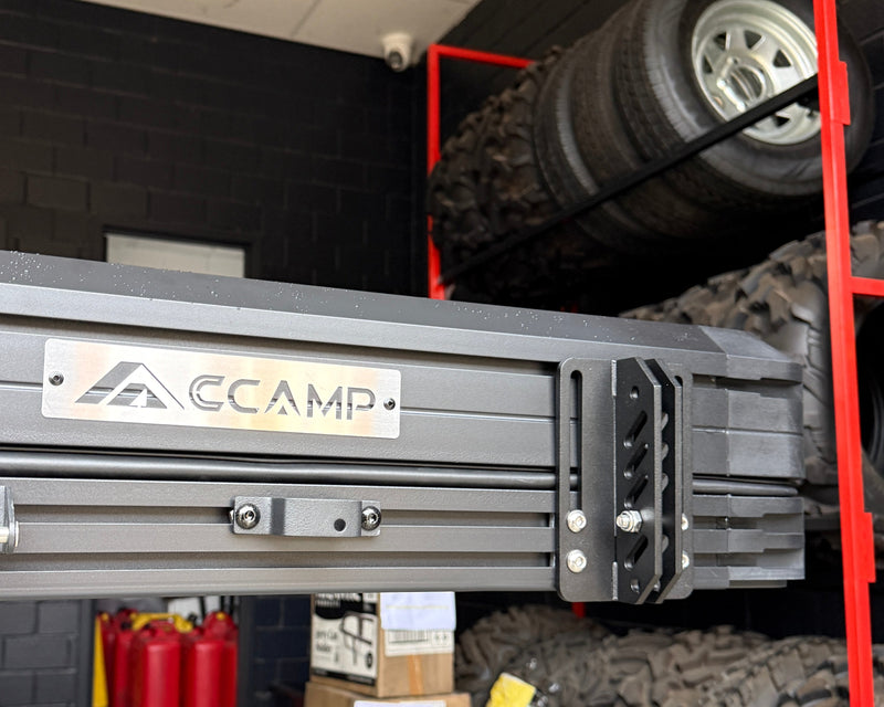 Load image into Gallery viewer, Mechanical lift with 'ccamp' branding in a garage setting
