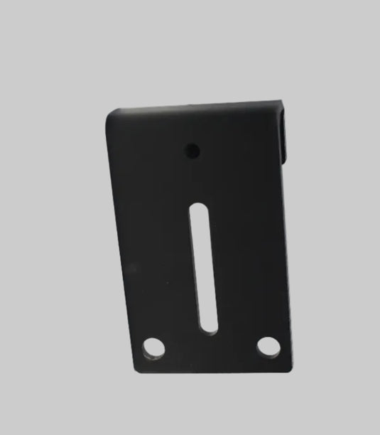 Black metal bracket on a white surface with a gray background